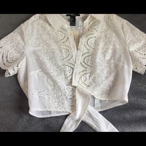 A white shirt with floral patterns